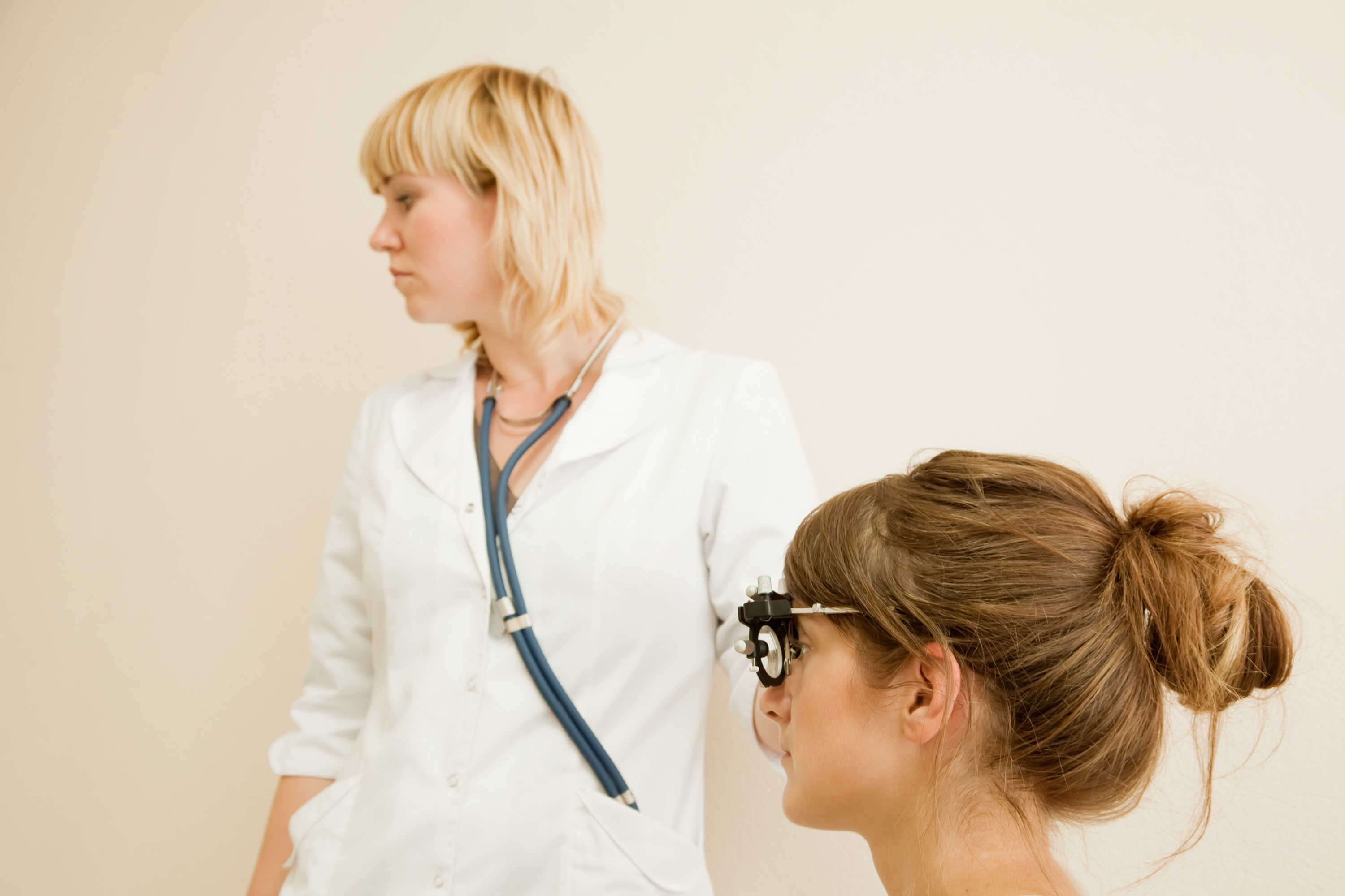 ophthalmologist  and patient testing  eyesight  in clinic